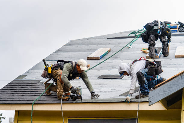 Professional Gutter Installation technician working in Hardin, MO